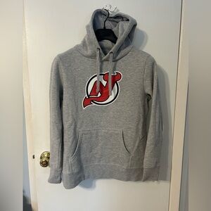 NJ Devils hockey hoodie featuring Jack Hugh’s name and number on back.